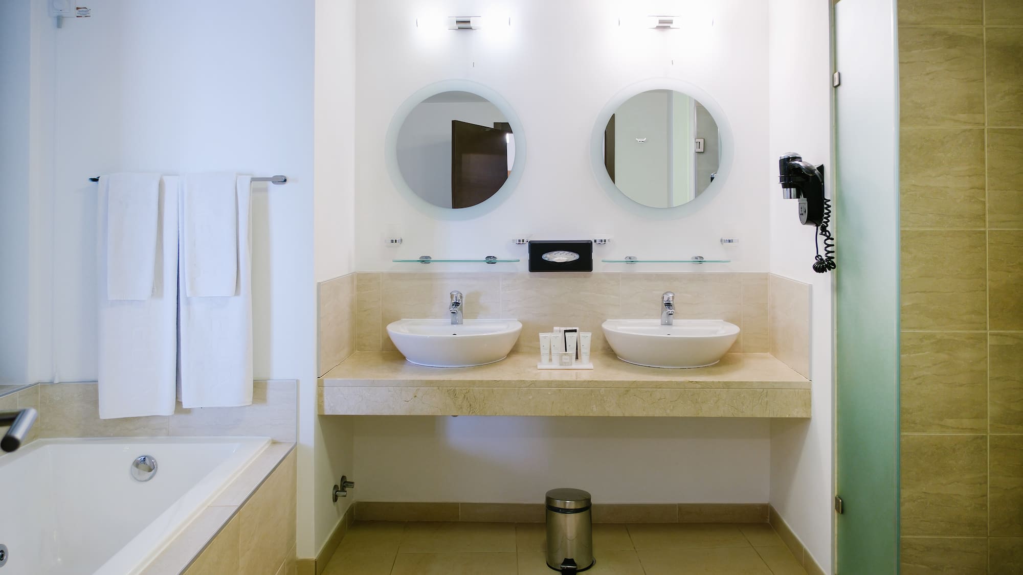 a bathroom with two sinks and a bathtub