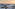 Amanecer en Palma de Mallorca con la Catedral, marina y montañas.