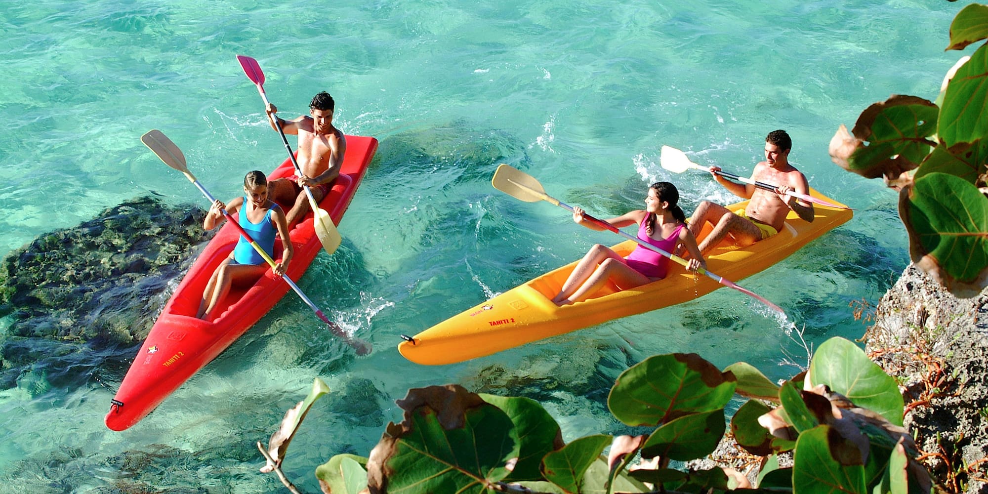 a group of people in kayaks on the water