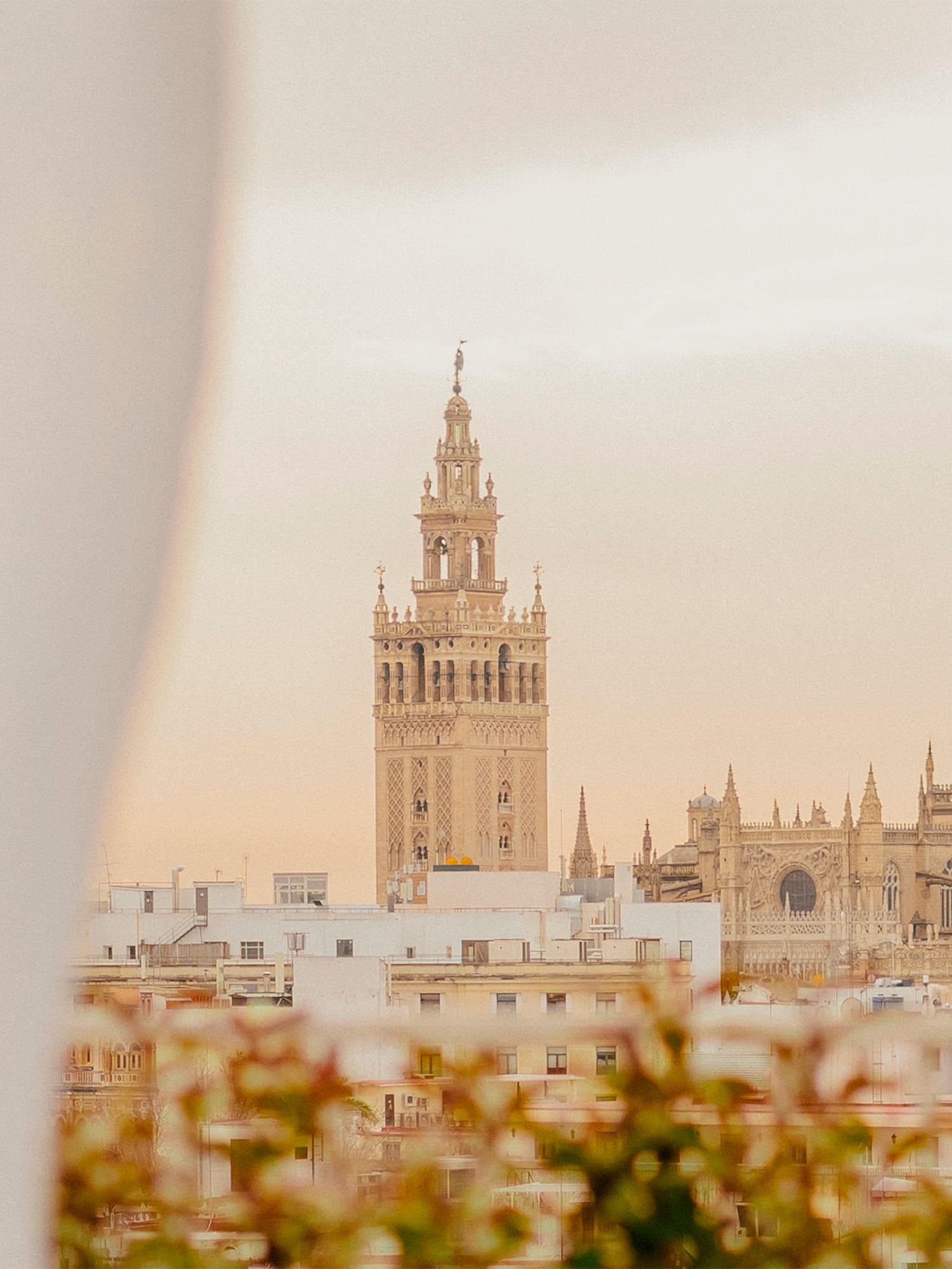 a tall building with a tower in the background