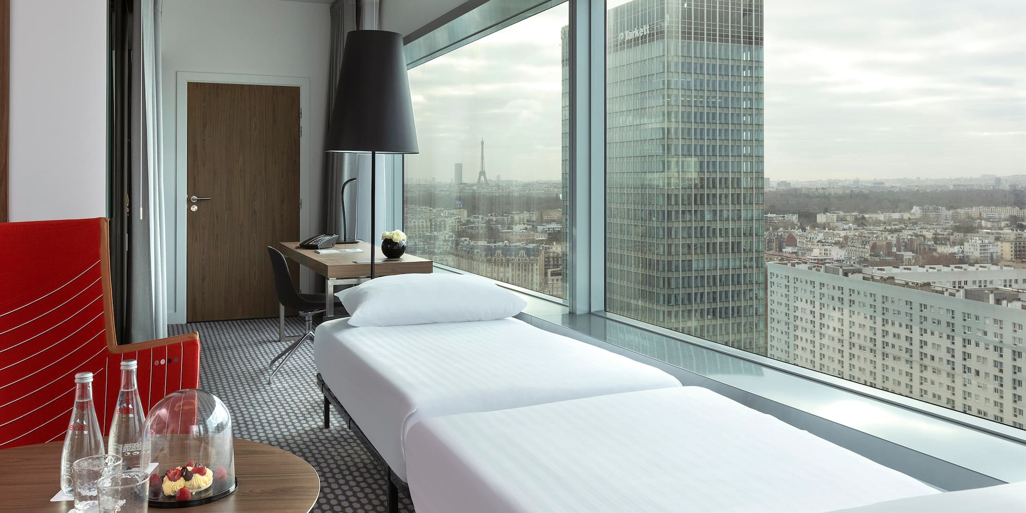 a room with a window overlooking a city