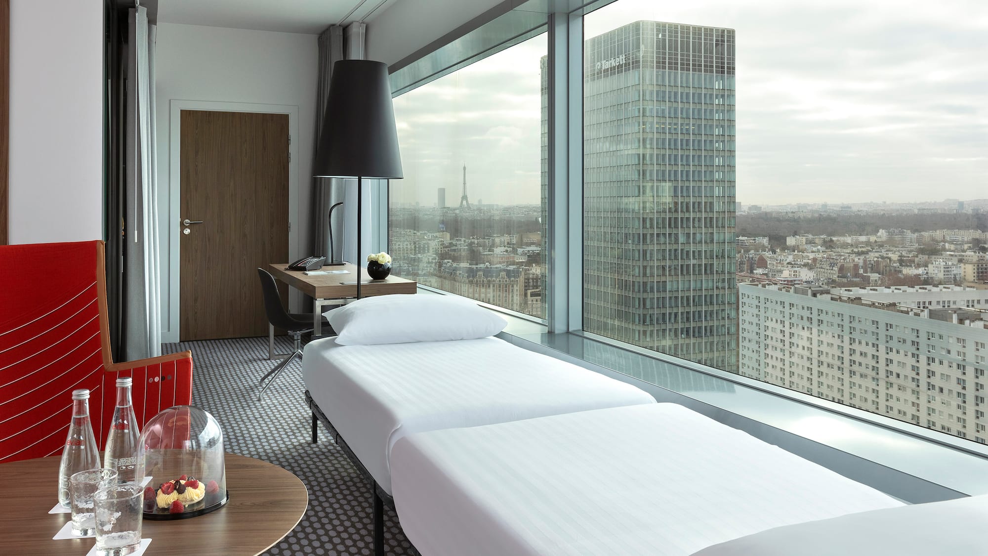 a room with a window overlooking a city