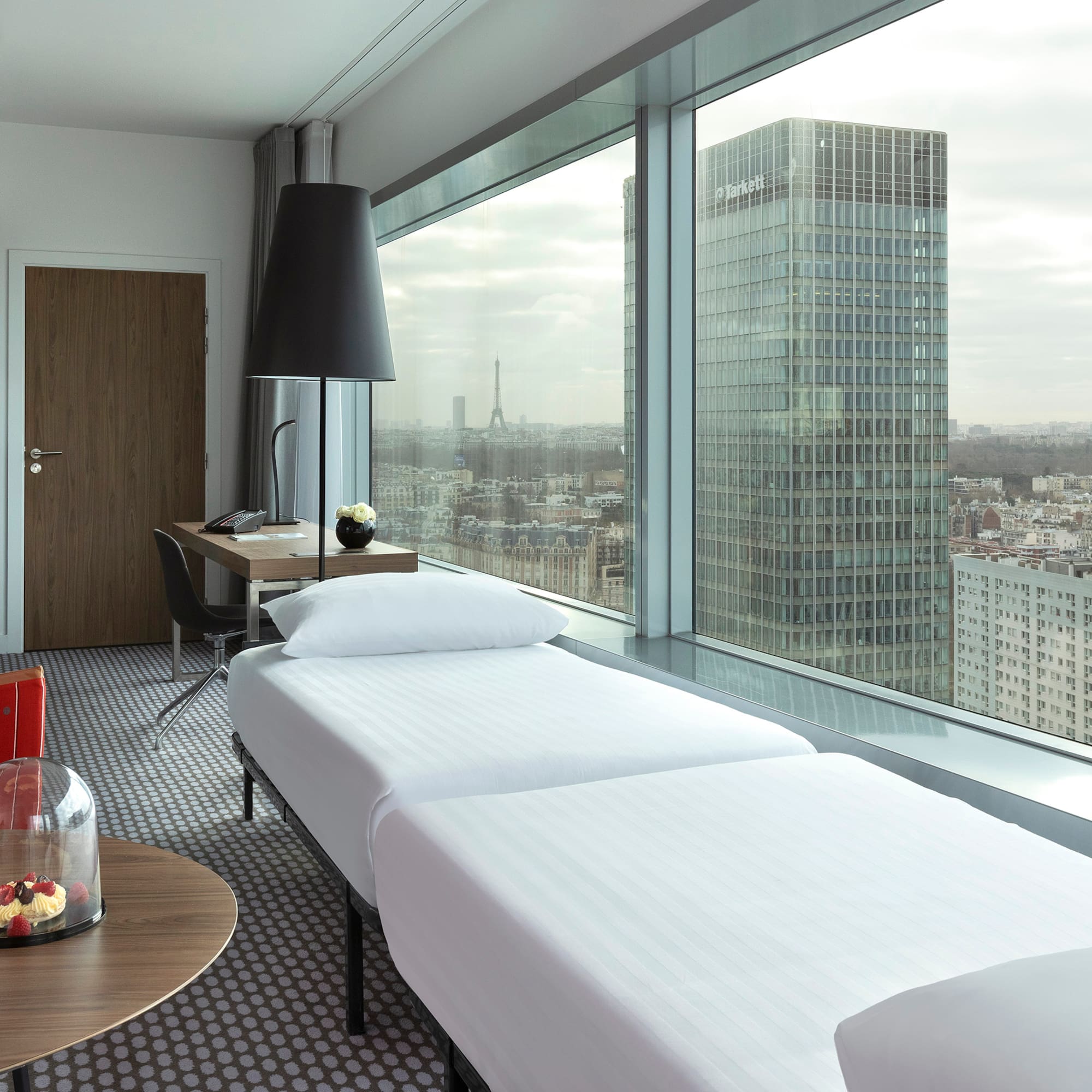 a room with a window overlooking a city