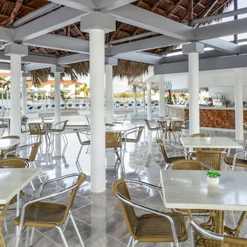 a restaurant with tables and chairs