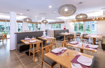 a restaurant with tables and chairs
