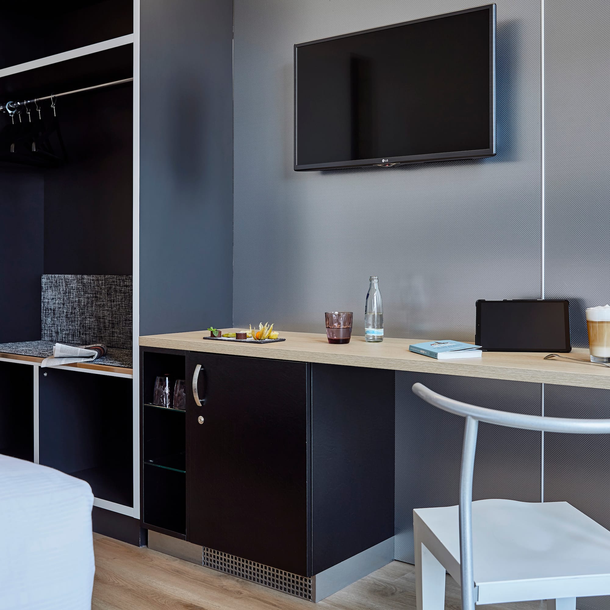 a room with a tv and a table