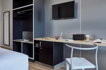 a room with a tv and a table