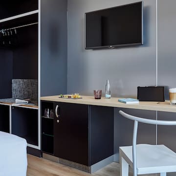 a room with a tv and a table