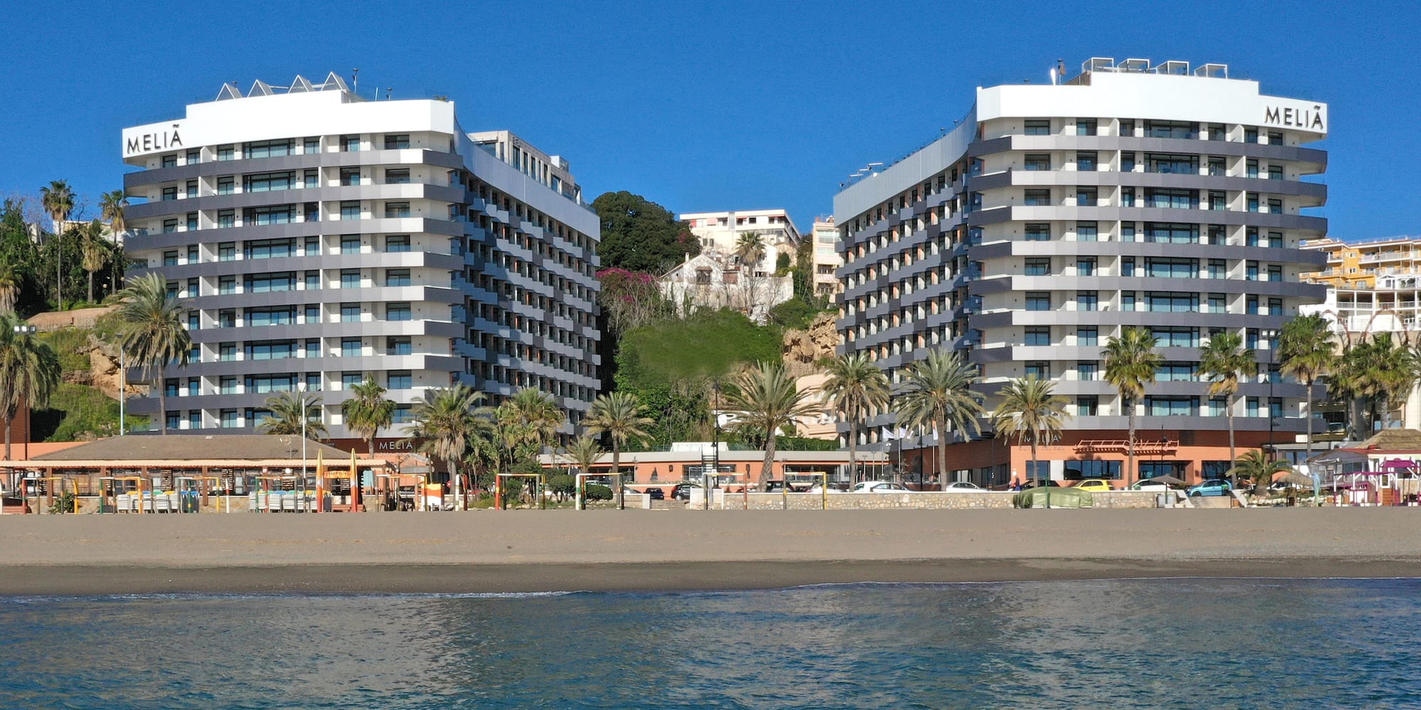 a group of buildings next to a body of water