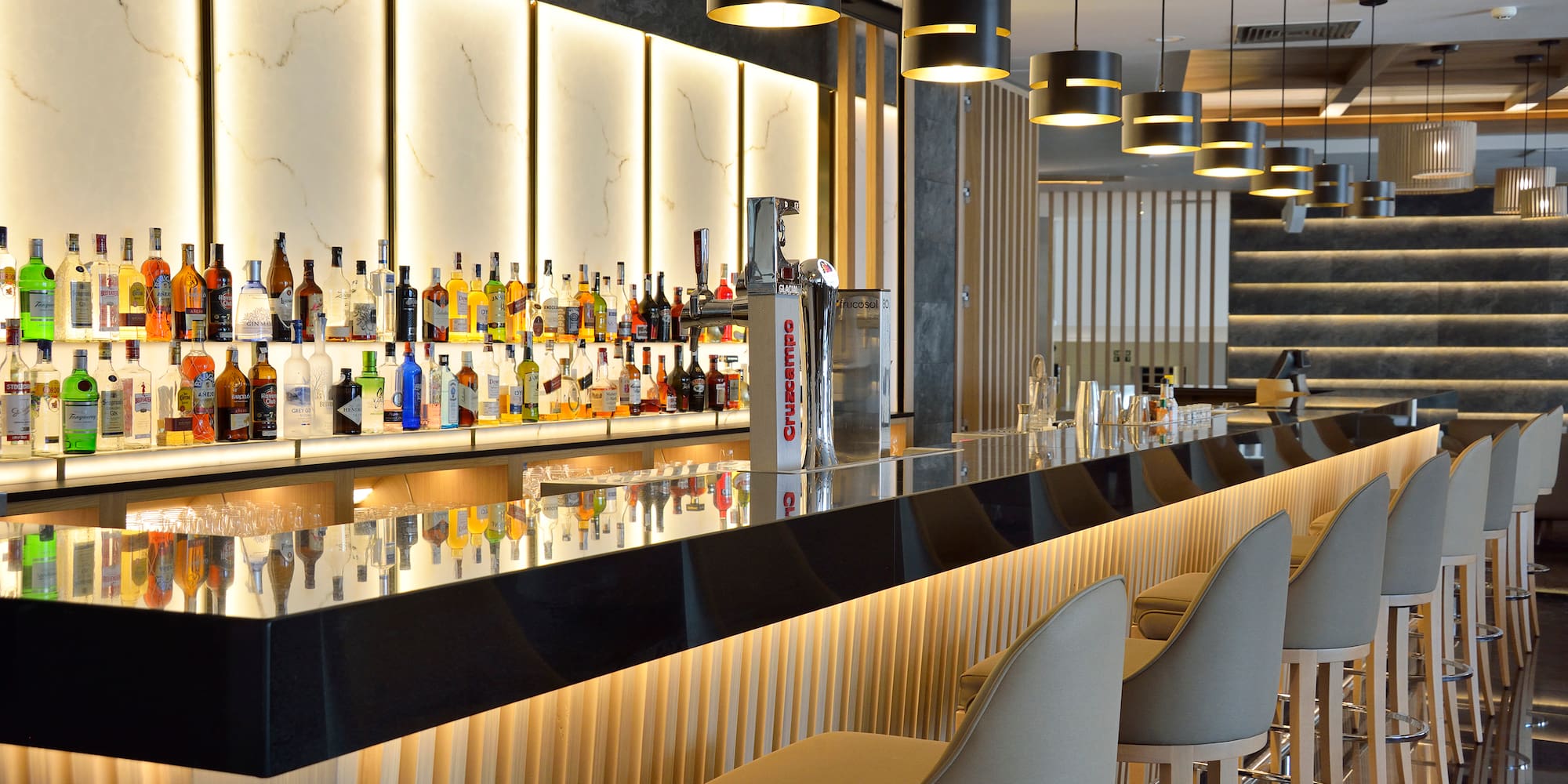 a bar with many bottles of alcohol