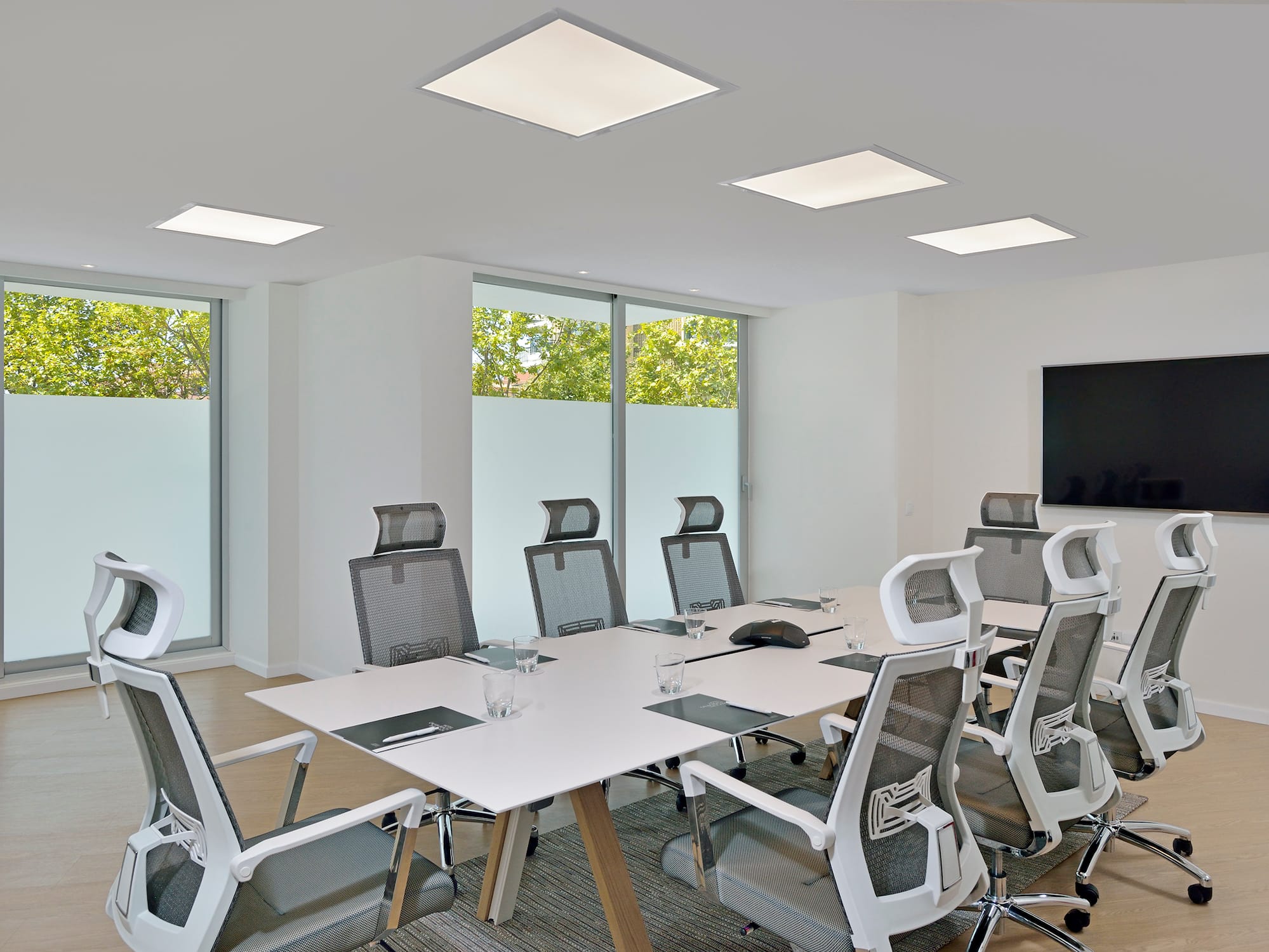 a conference room with a table and chairs