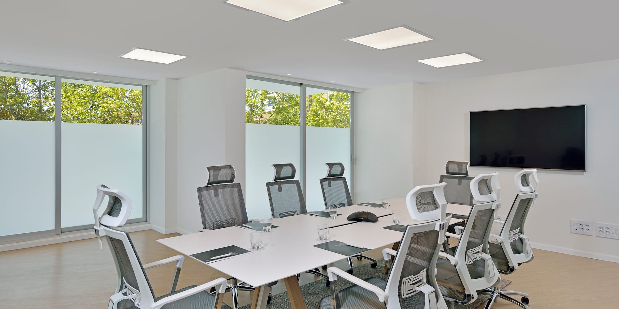a conference room with a table and chairs