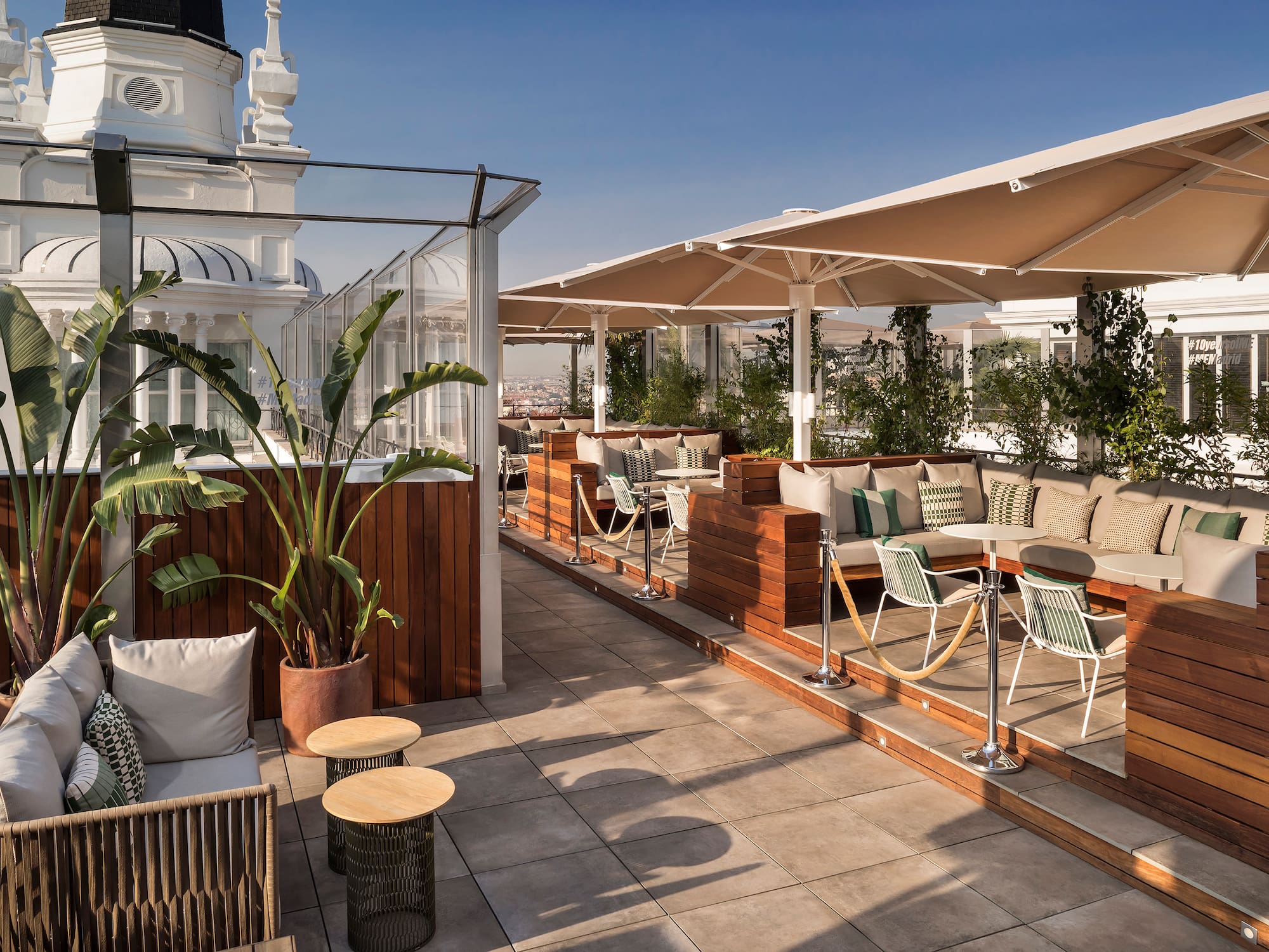 a patio with tables and chairs