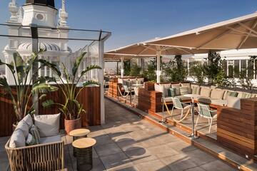 a patio with tables and chairs