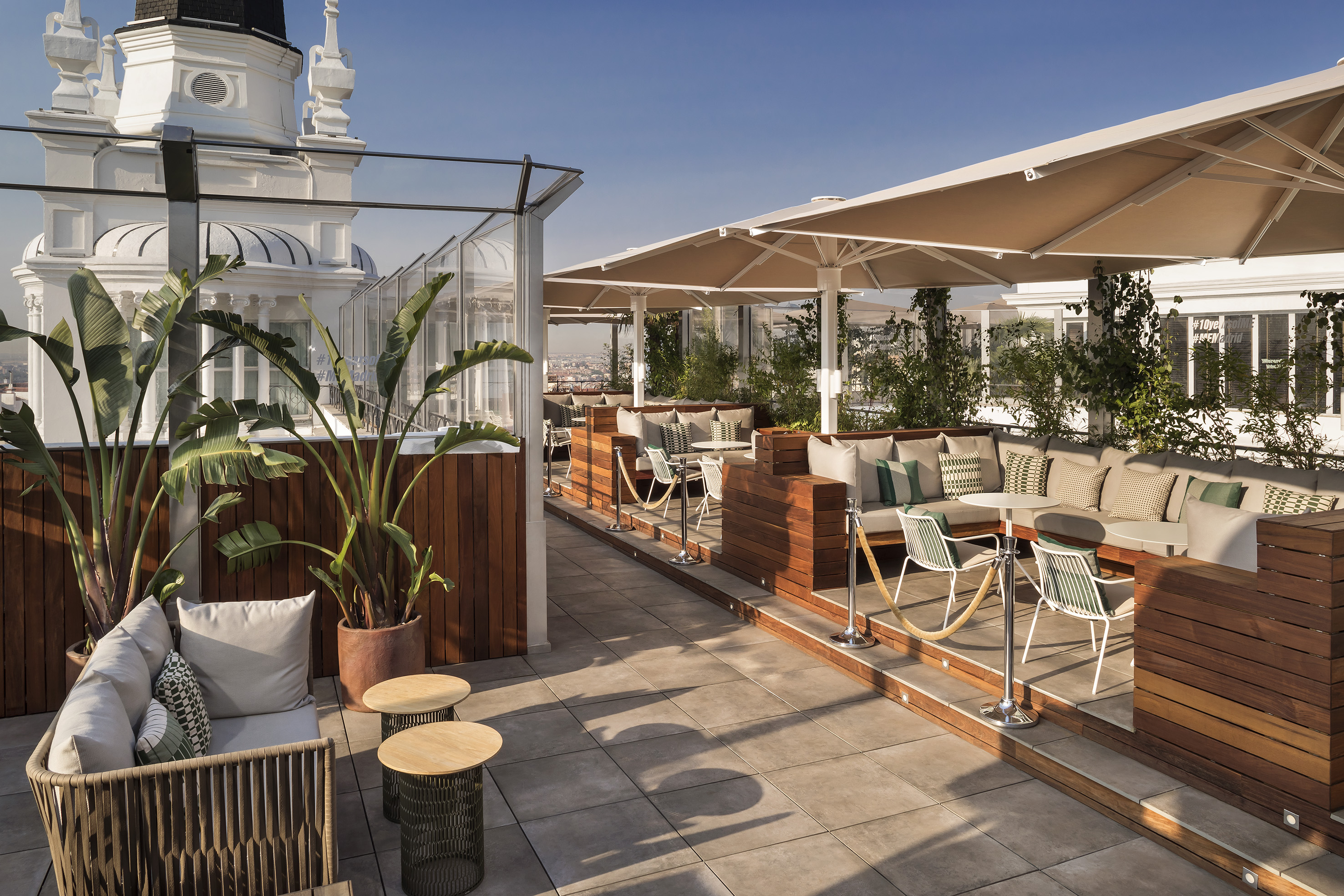 a patio with tables and chairs