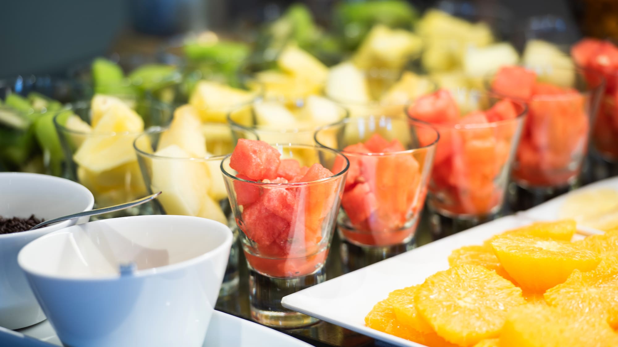 a group of glasses filled with fruit
