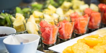 a group of glasses filled with fruit