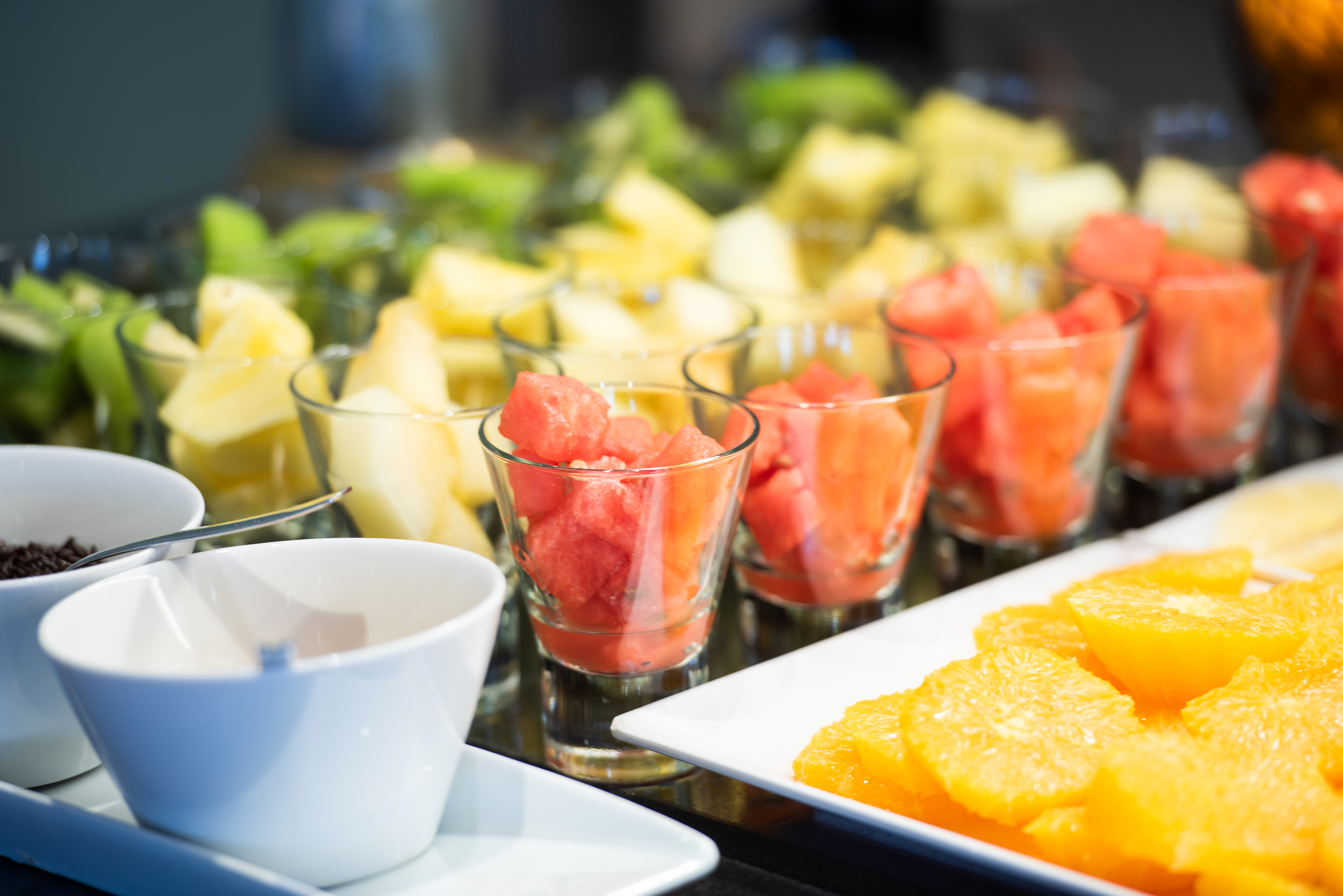 a group of glasses filled with fruit