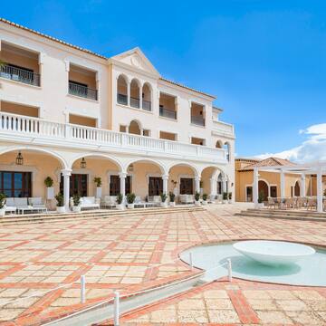 a building with a fountain in front of it