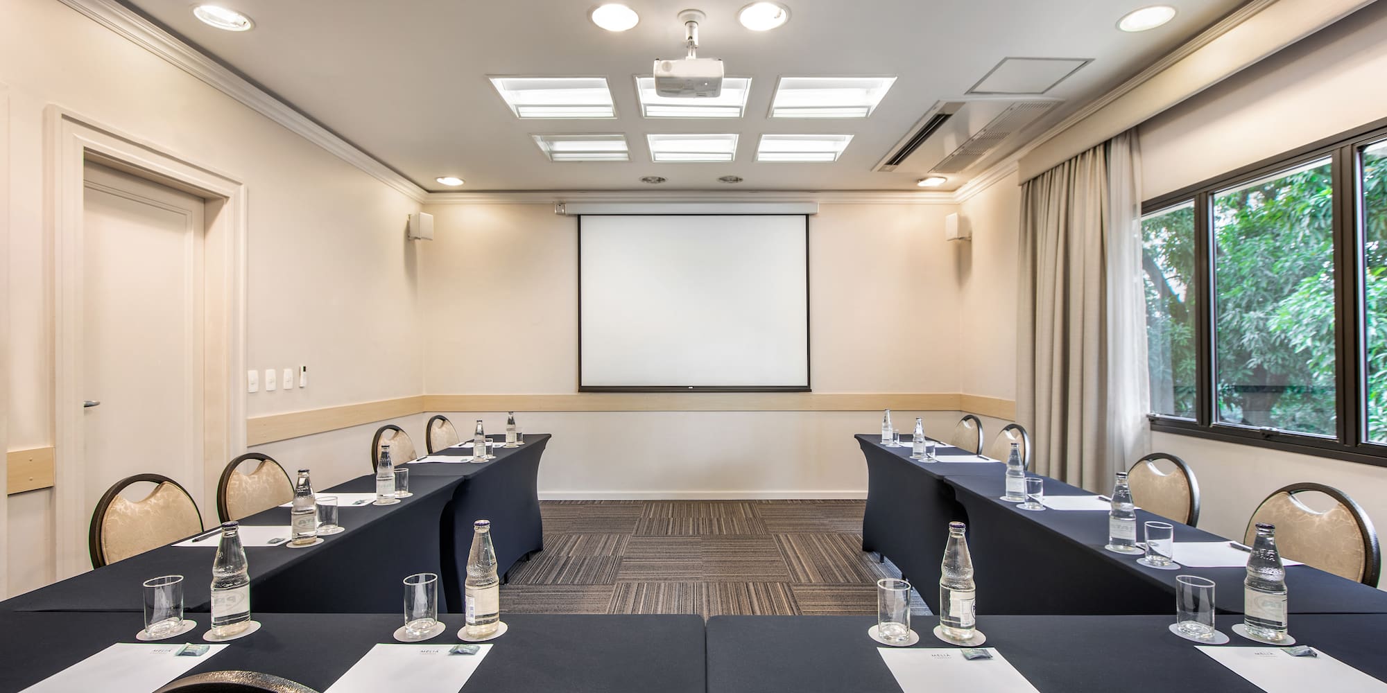 a room with tables and chairs