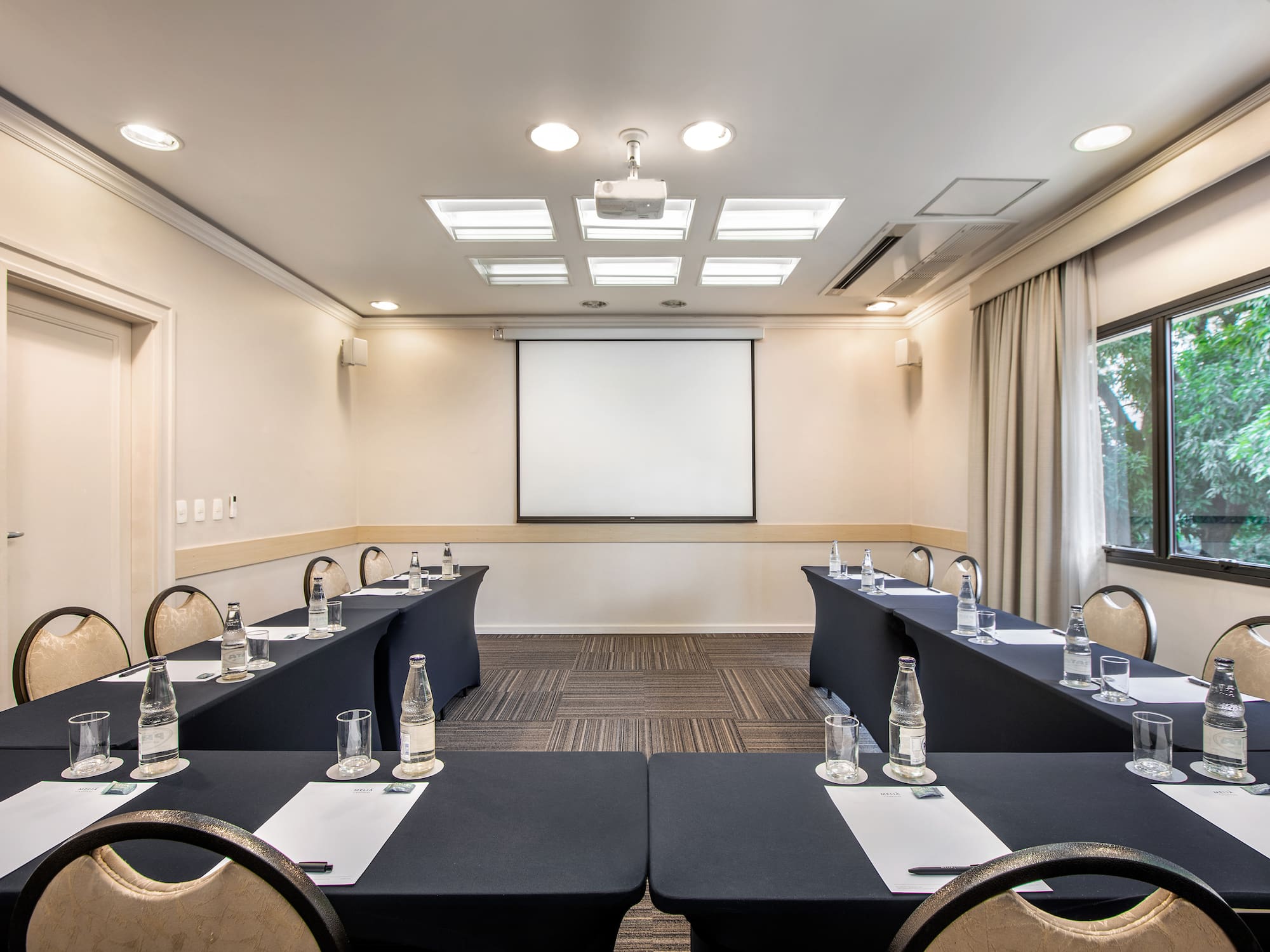 a room with tables and chairs