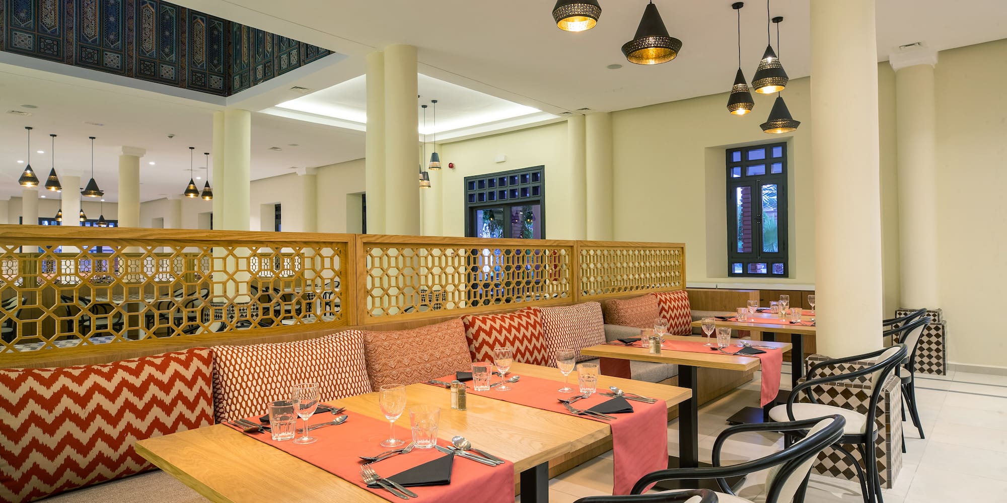 a restaurant with tables and chairs