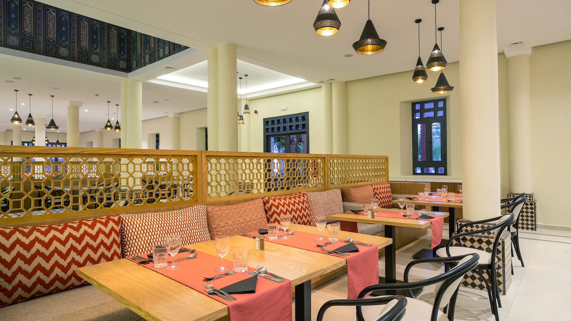 a restaurant with tables and chairs