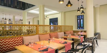 a restaurant with tables and chairs