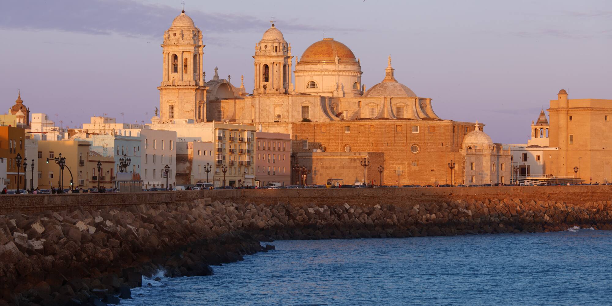 a building with domes and a body of water