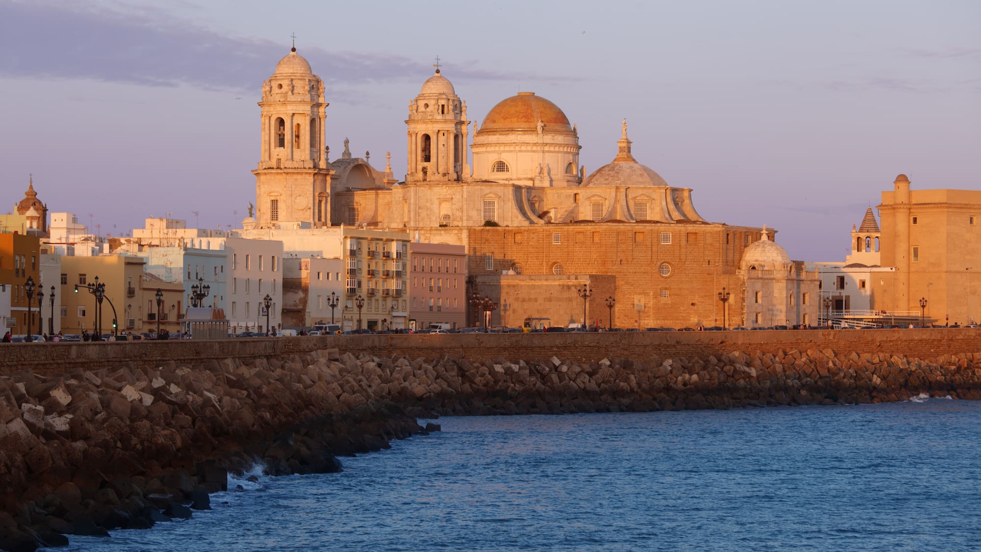 a building with domes and a body of water
