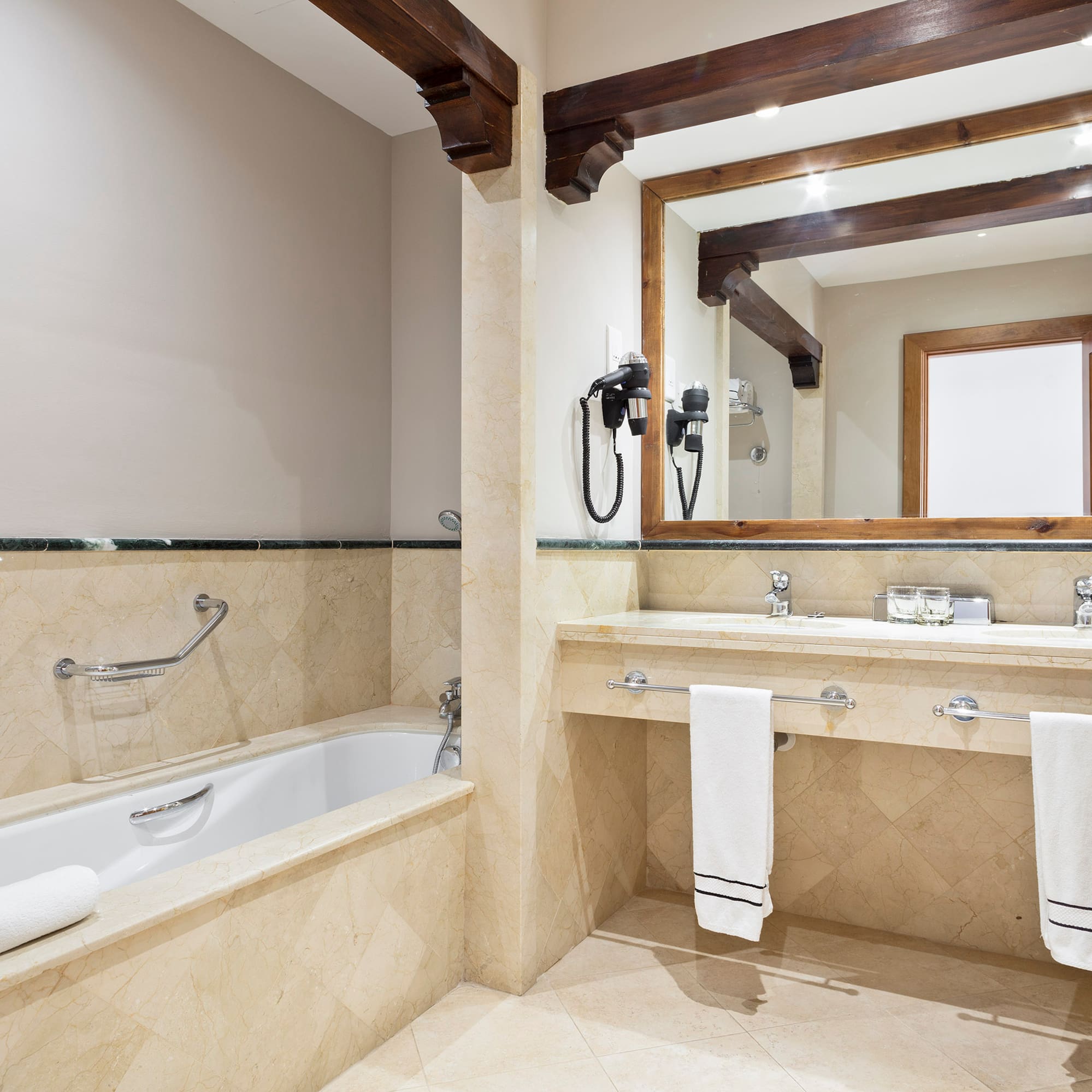 a bathroom with a bathtub and a mirror