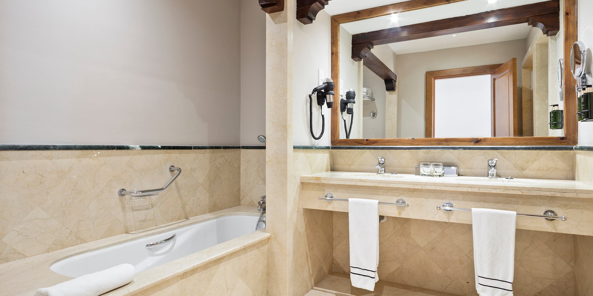 a bathroom with a bathtub and a mirror