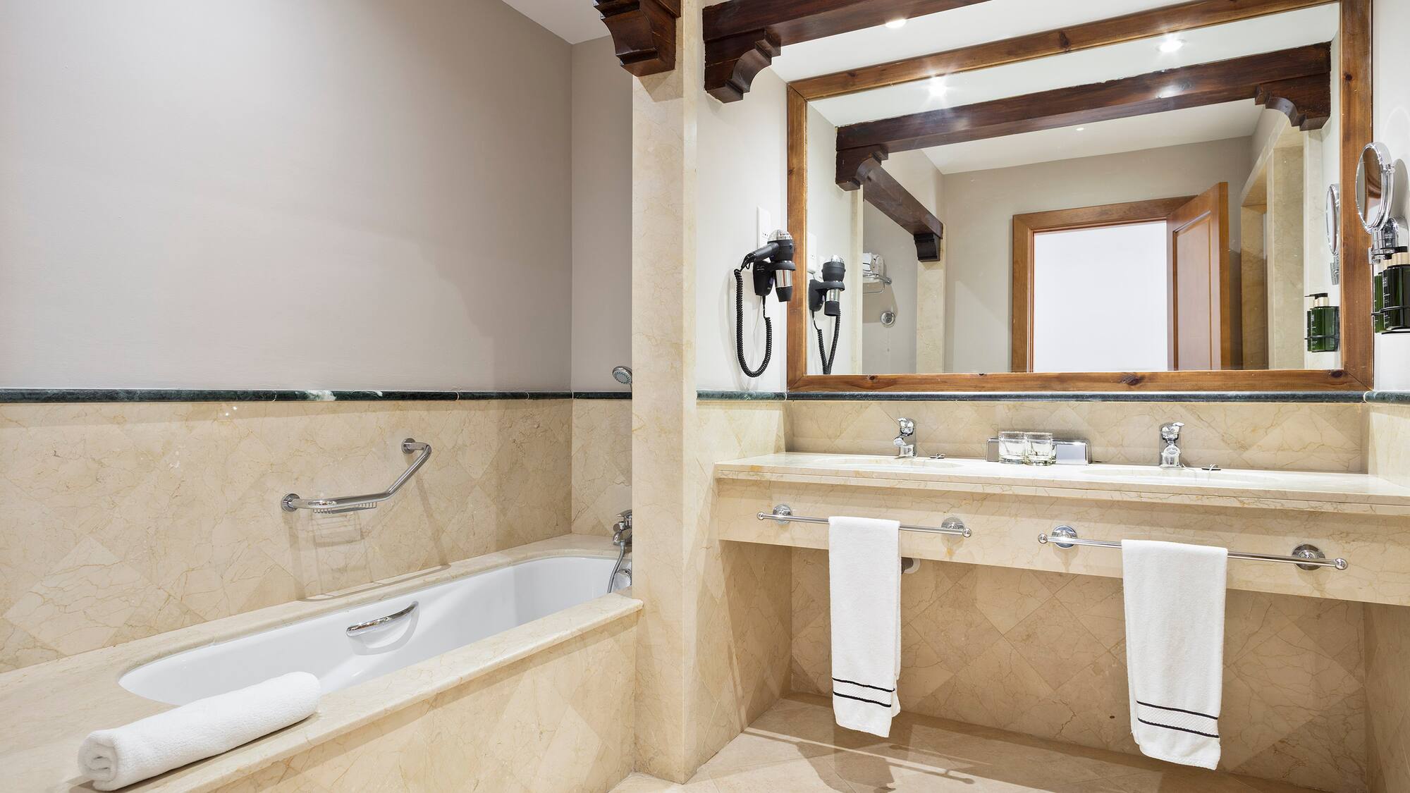 a bathroom with a bathtub and a mirror