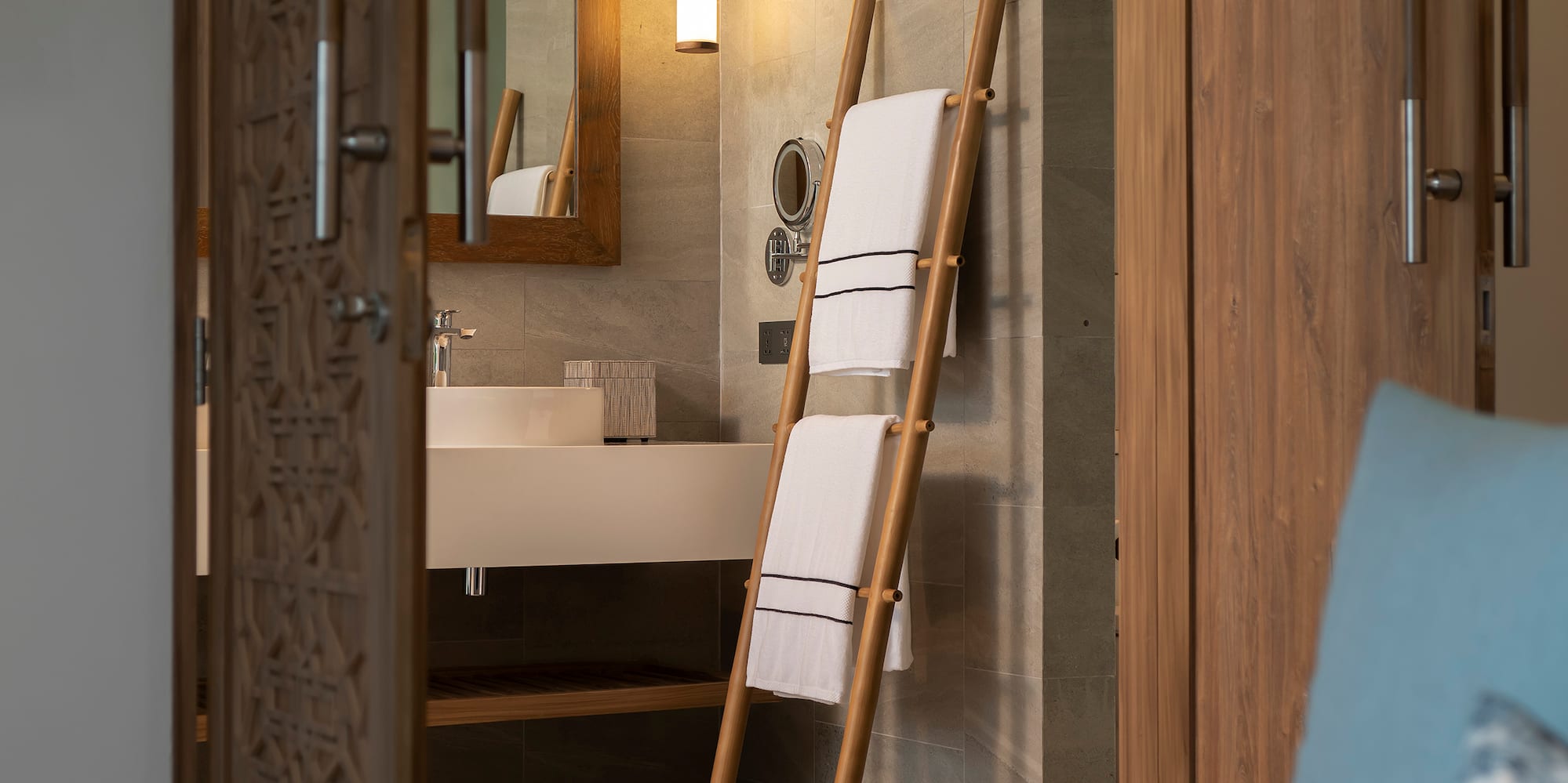 a bathroom with a mirror and a towel rack