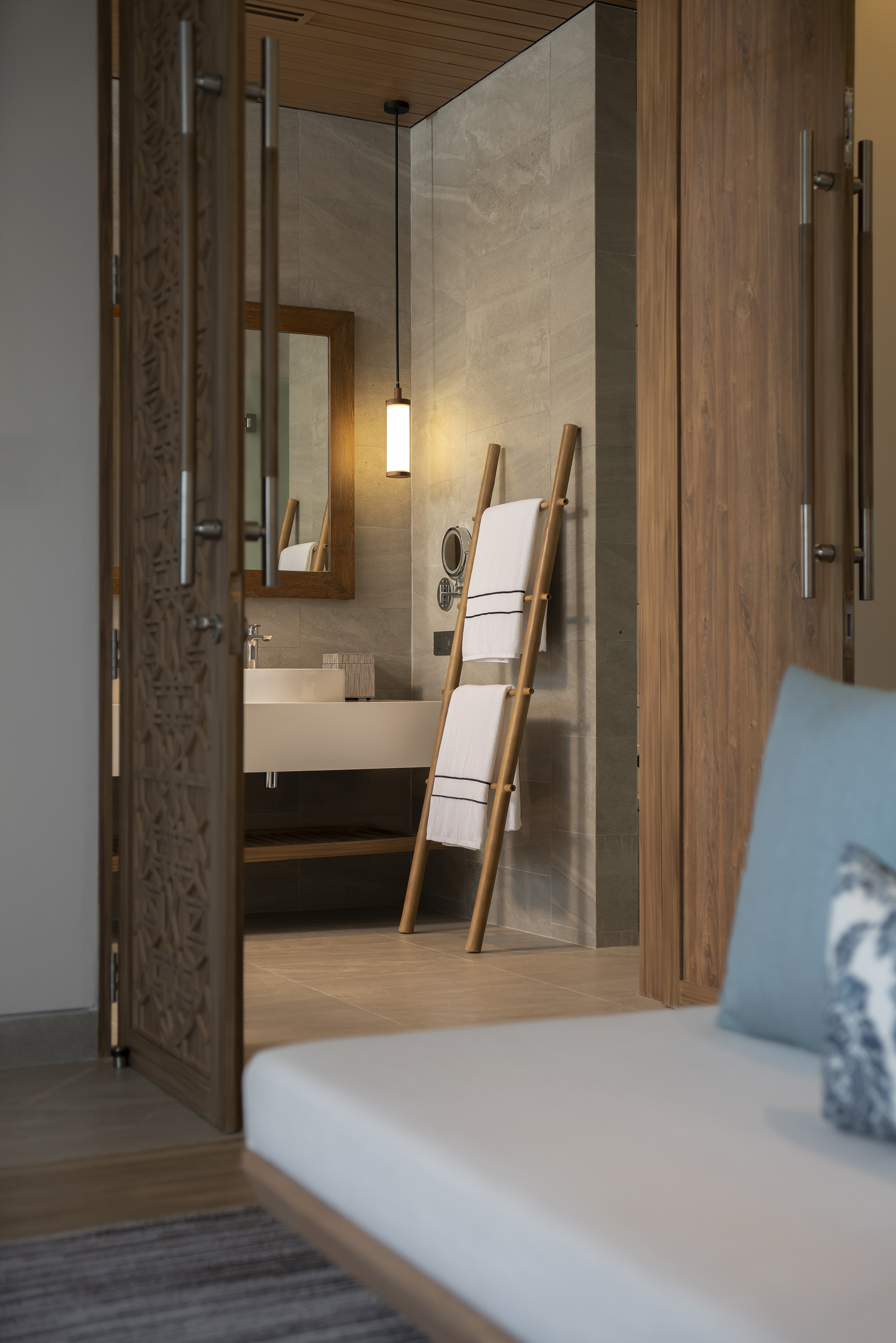 a bathroom with a mirror and a towel rack