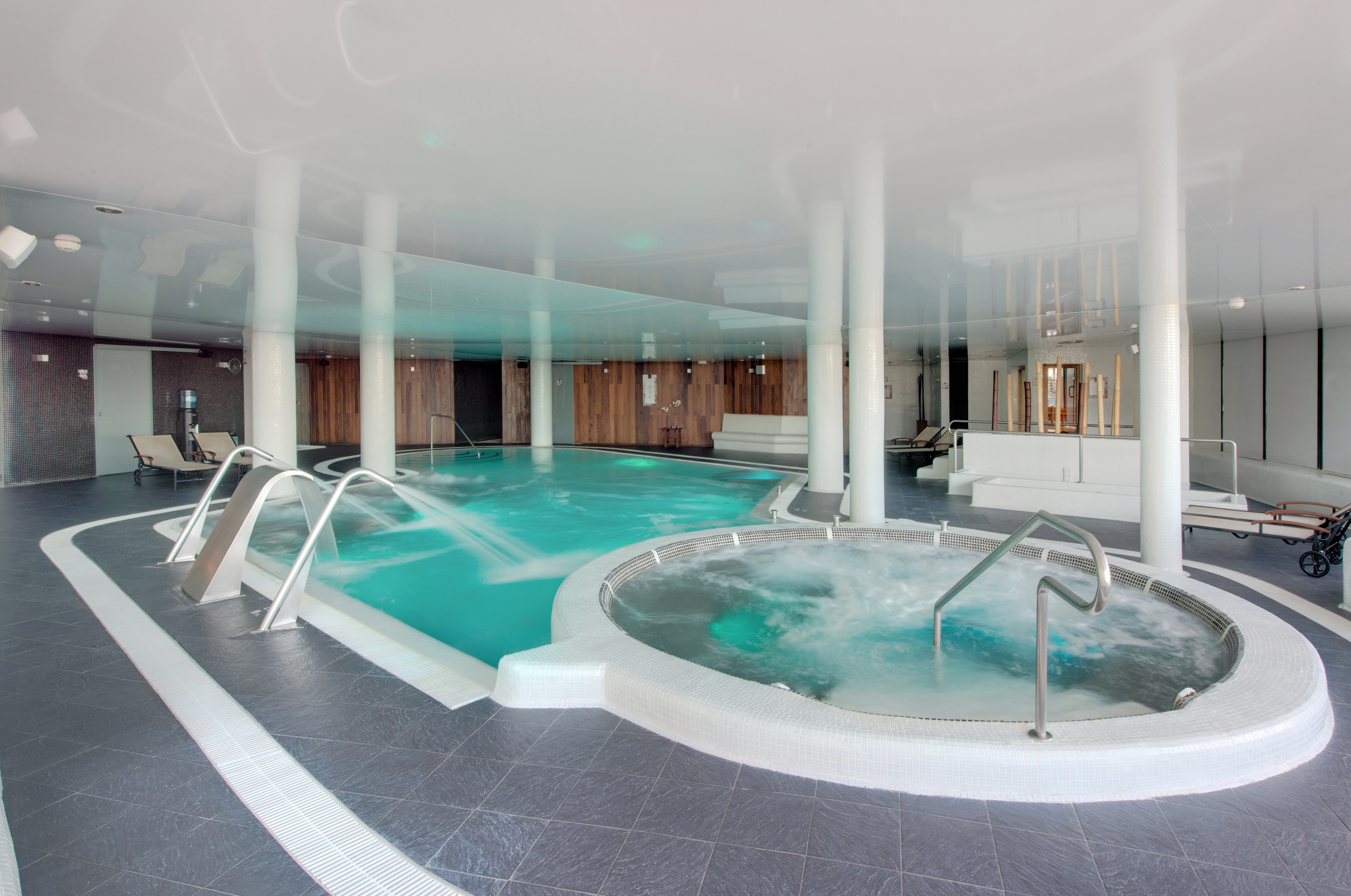 a large indoor jacuzzi with a hot tub