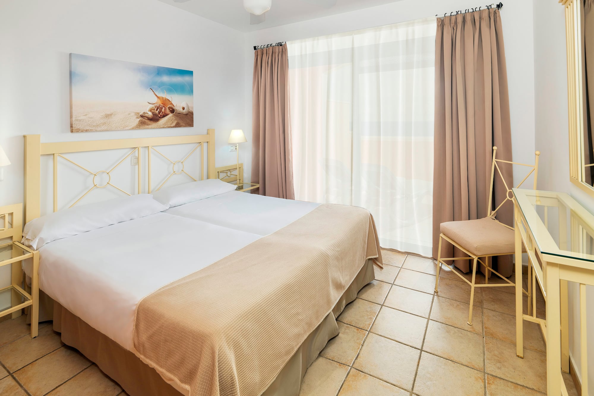 a bedroom with a bed and a fan