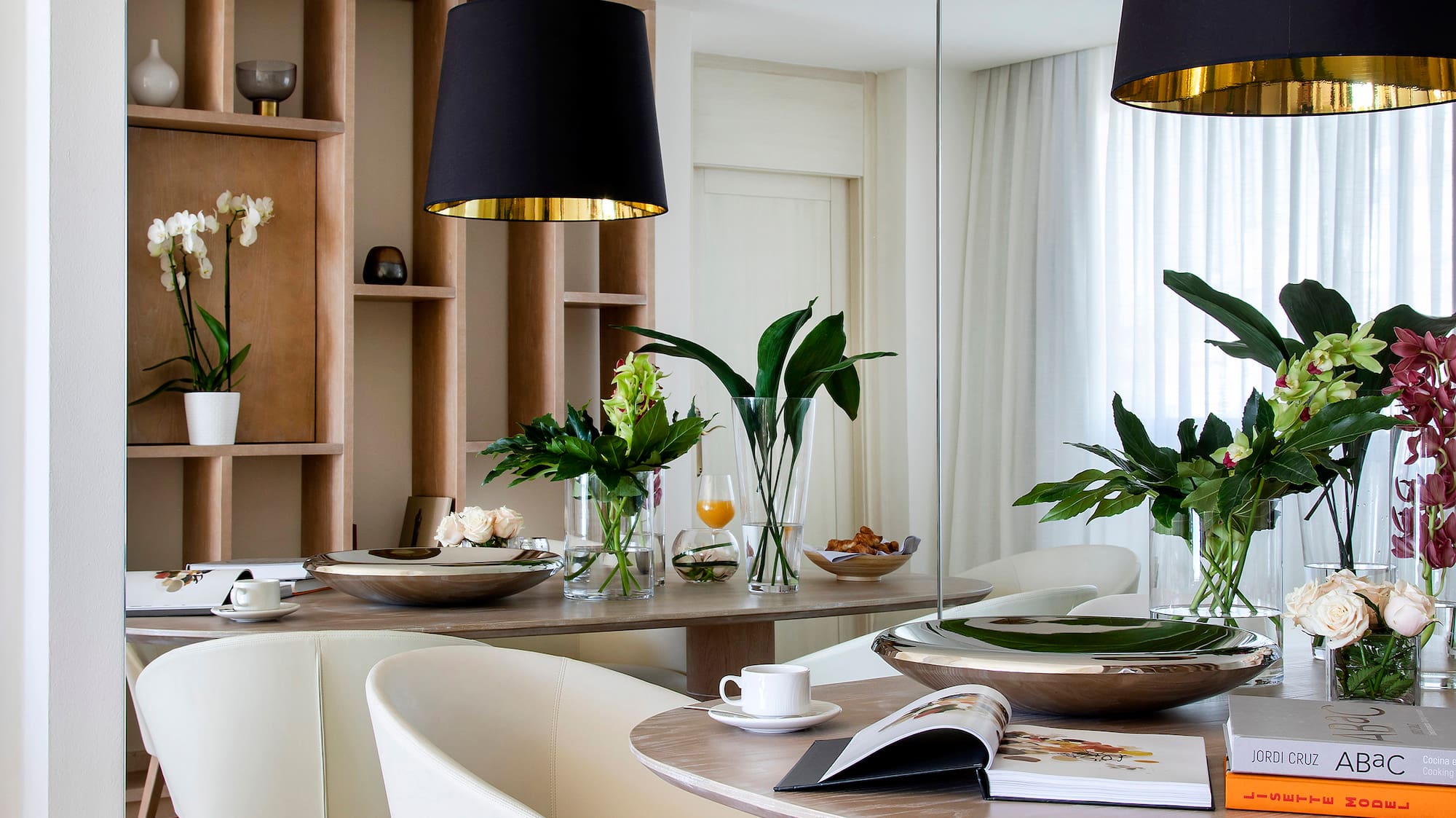 a dining room with a table and chairs