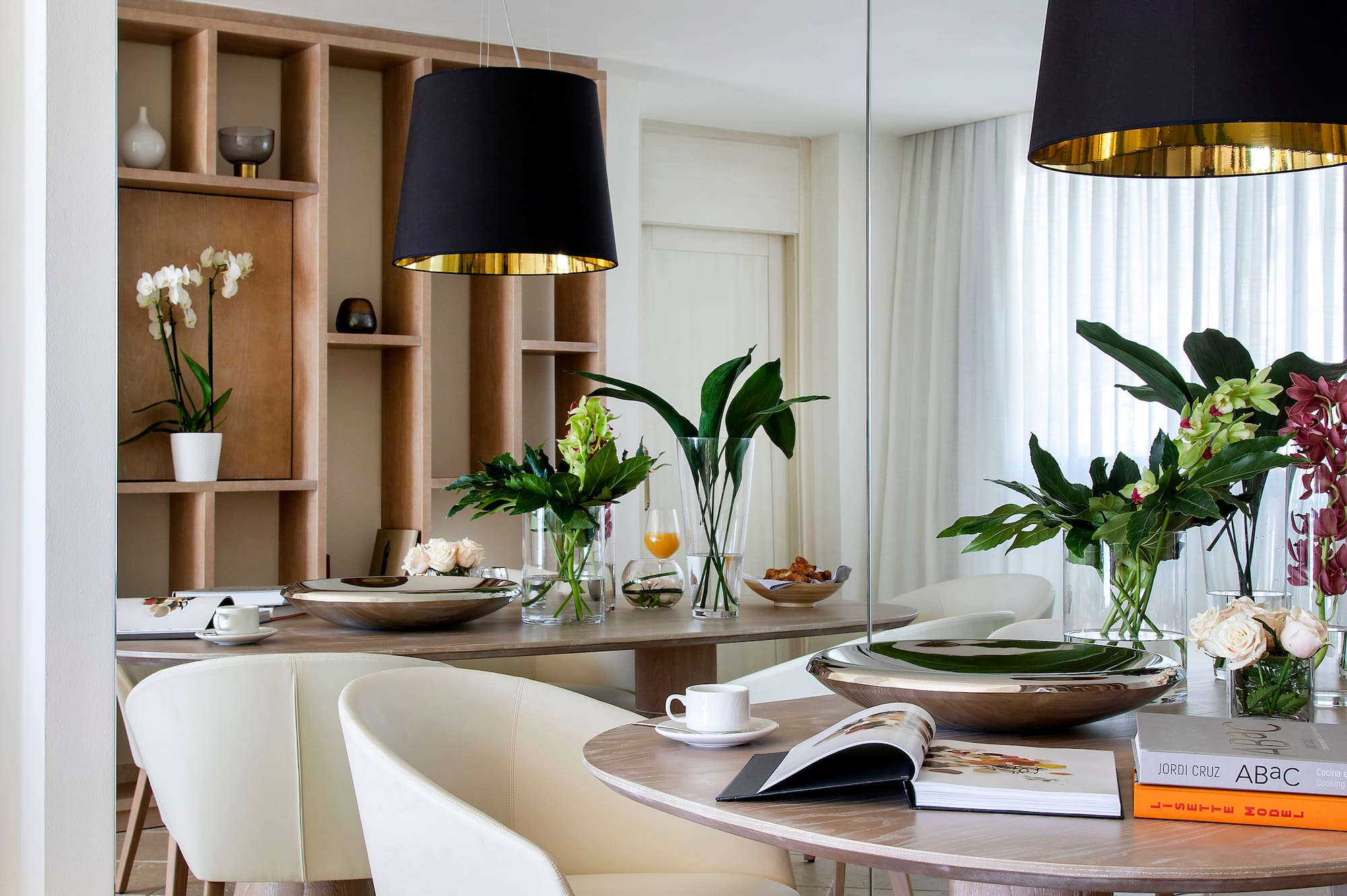 a dining room with a table and chairs