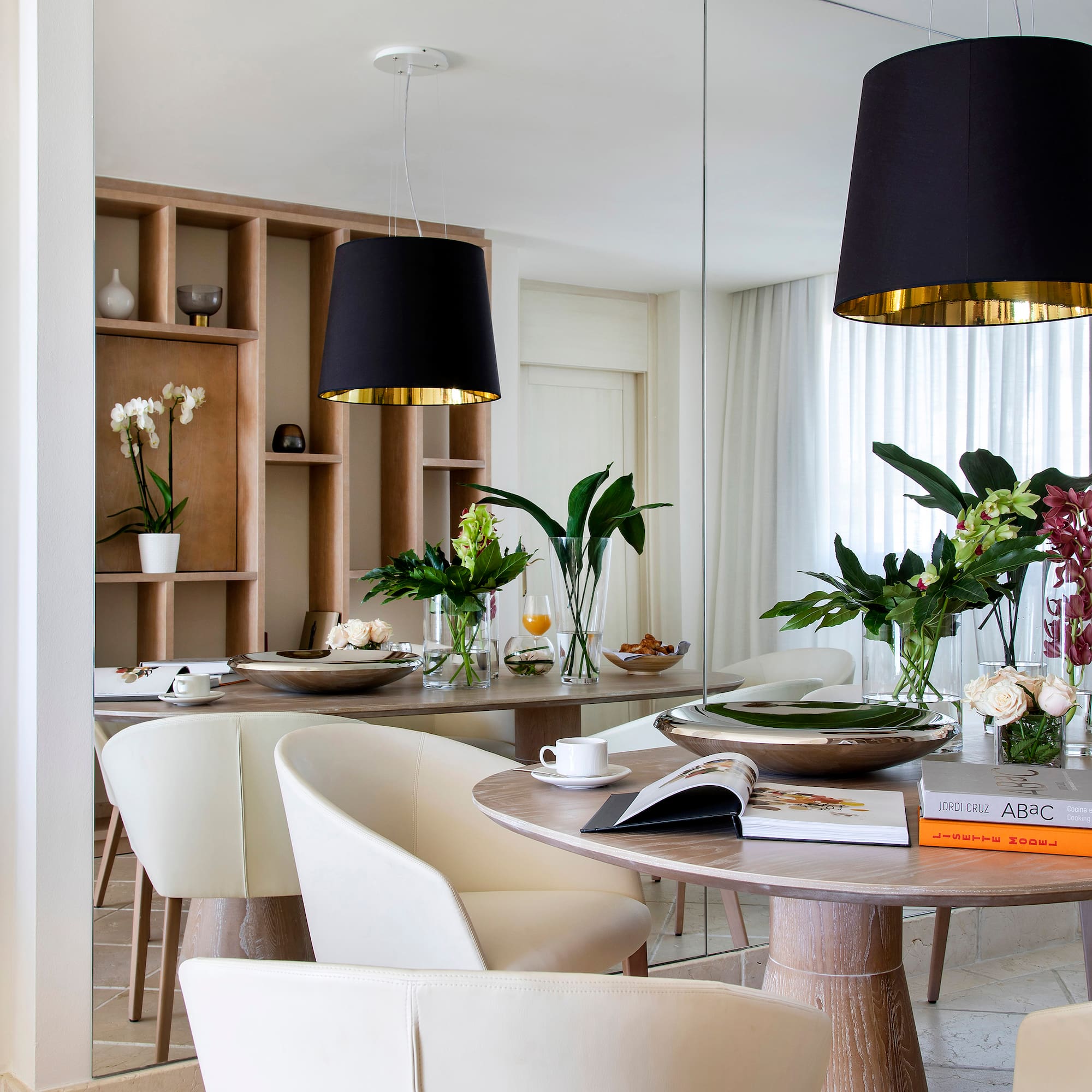 a dining room with a table and chairs