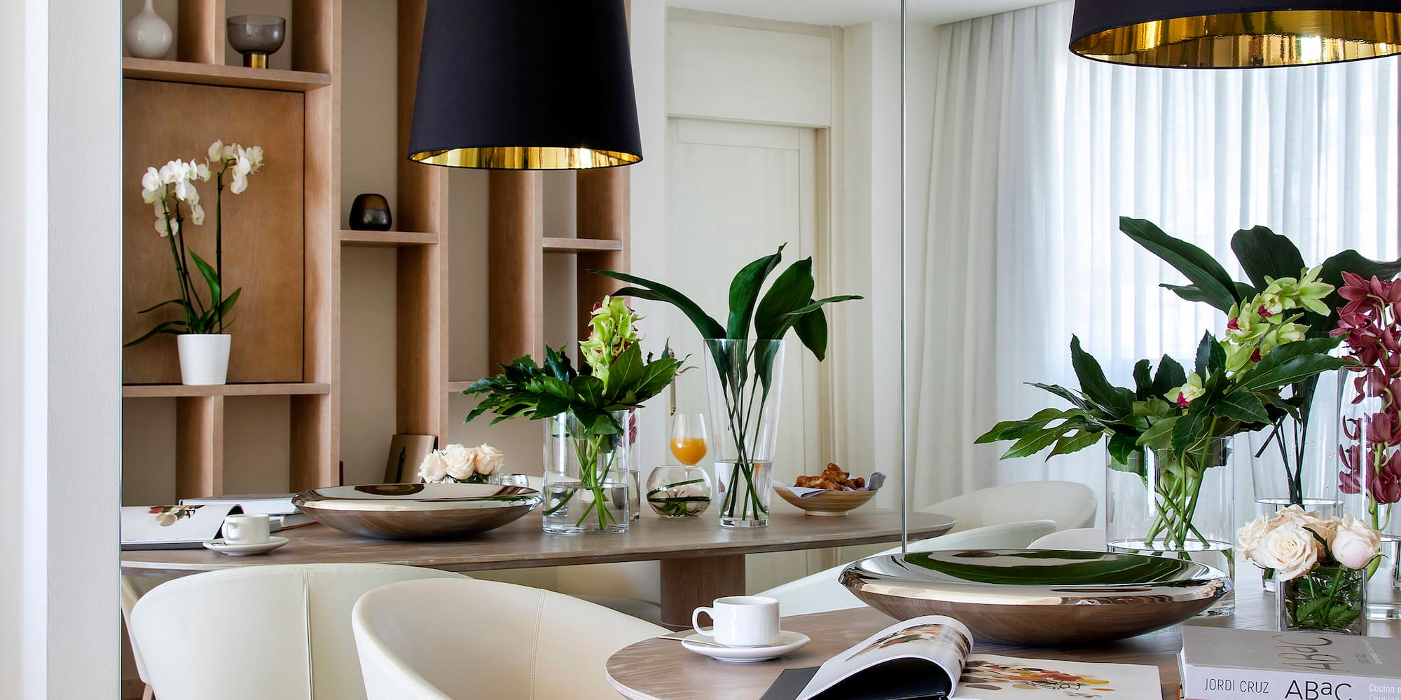 a dining room with a table and chairs