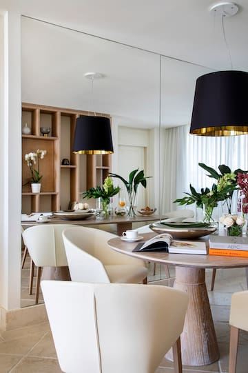 a dining room with a table and chairs