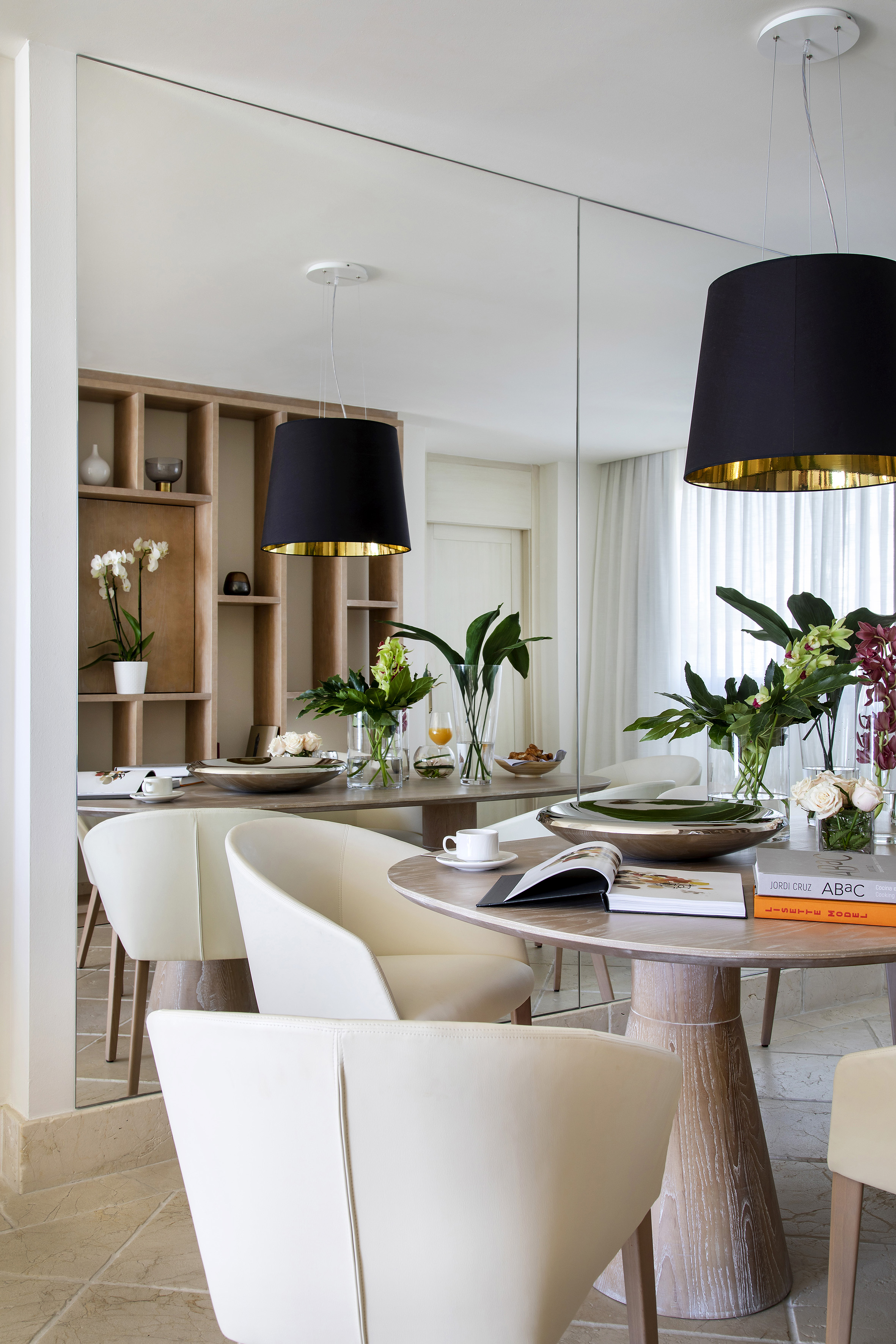 a dining room with a table and chairs