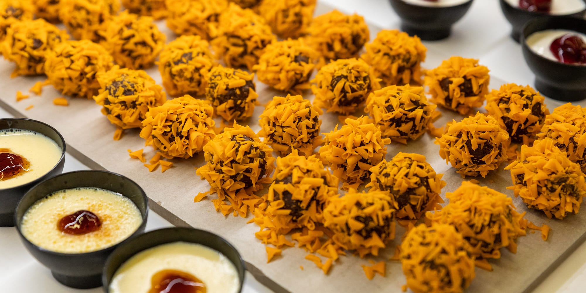 a tray of desserts with different toppings