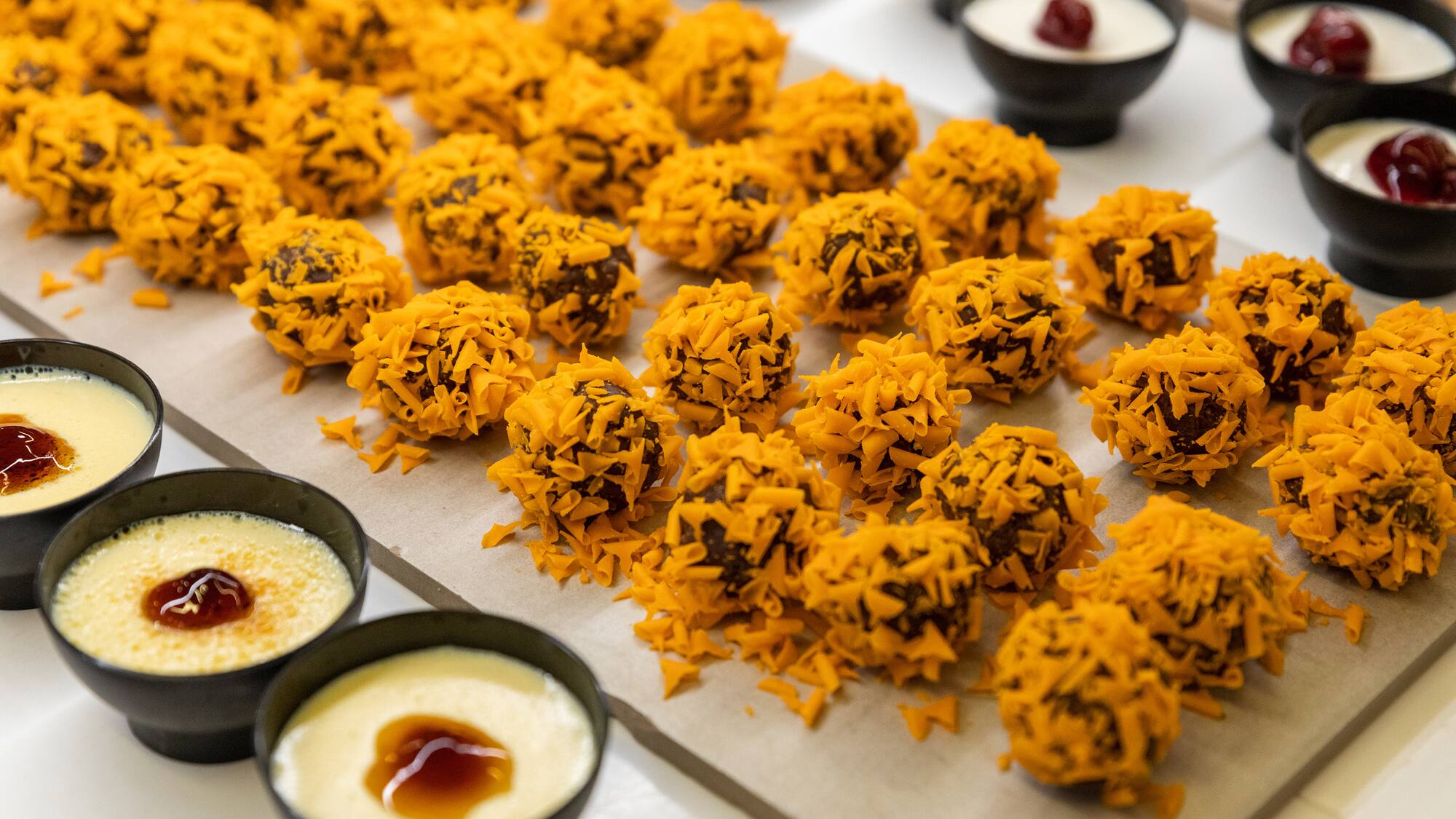 a tray of desserts with different toppings