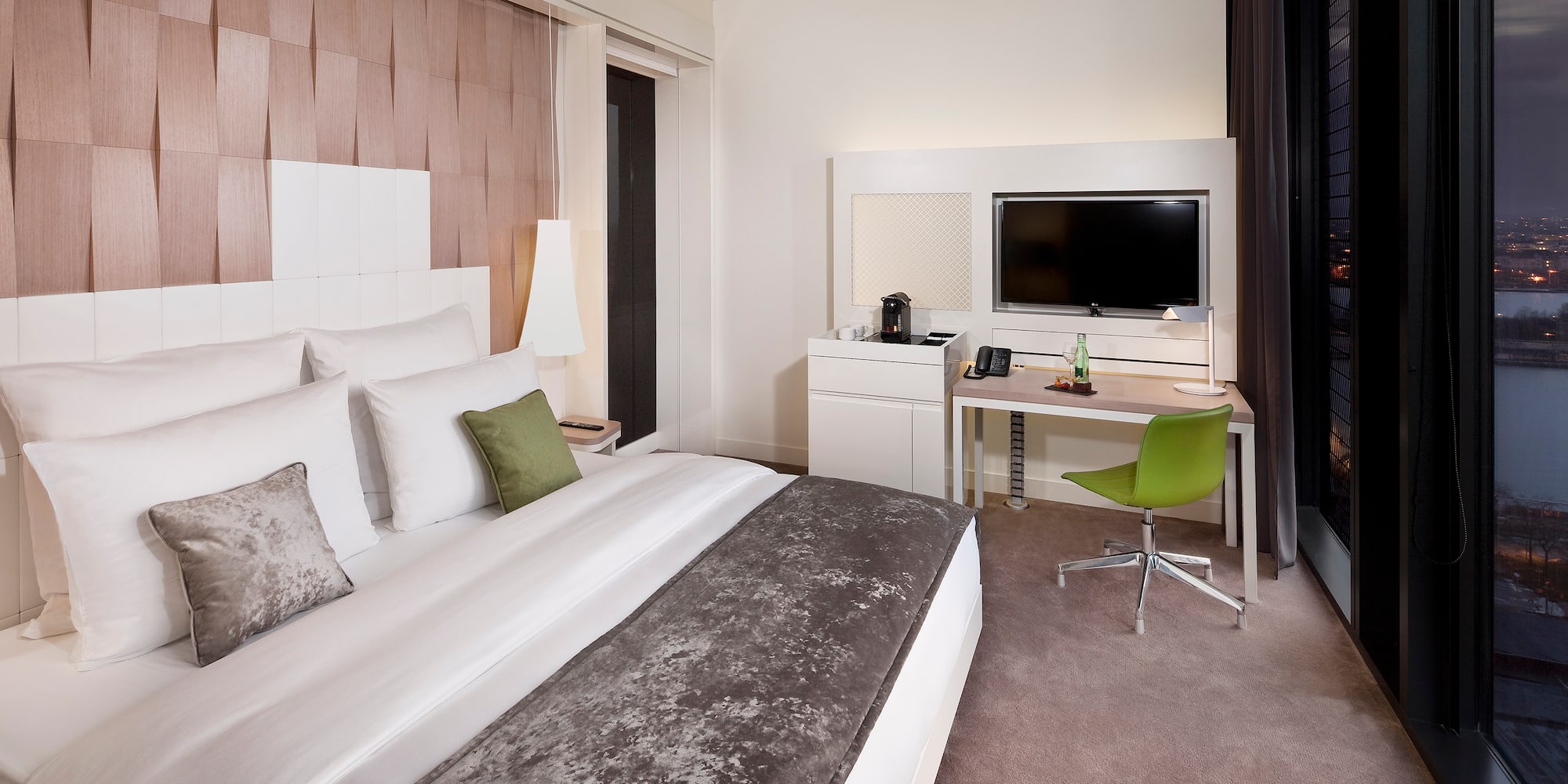 a room with a bed and a desk