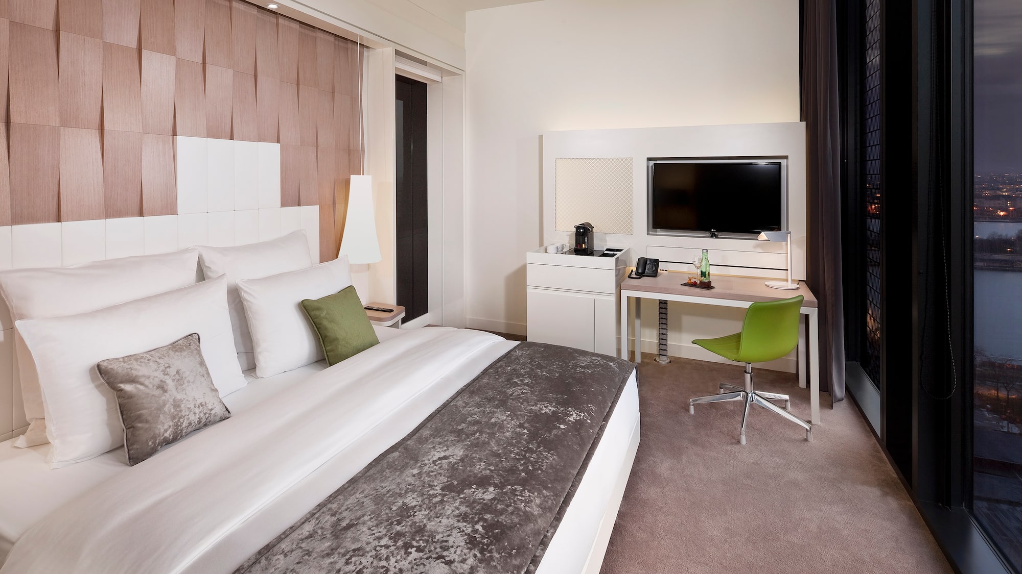 a room with a bed and a desk