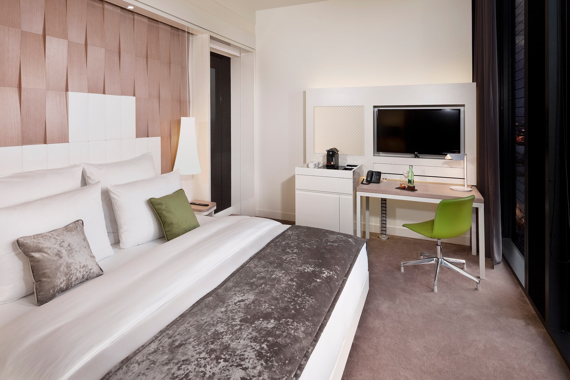 a room with a bed and a desk