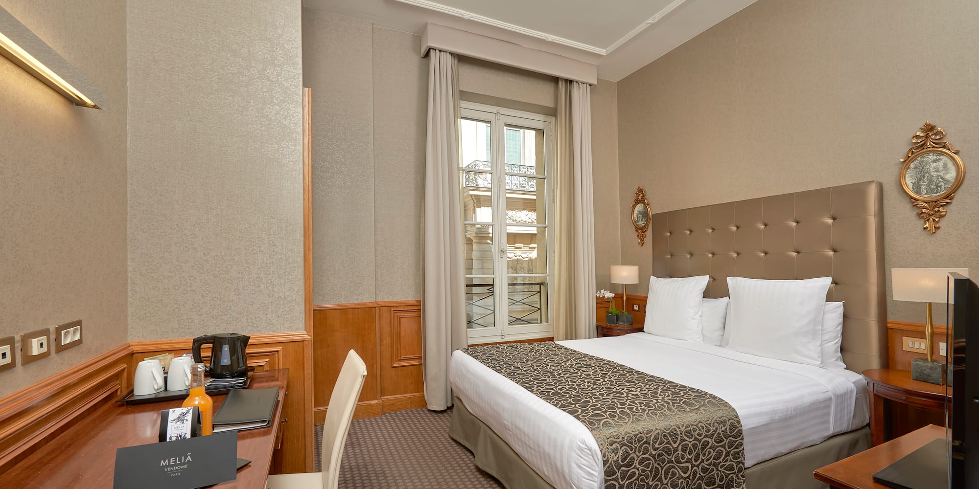 a room with a bed and a desk