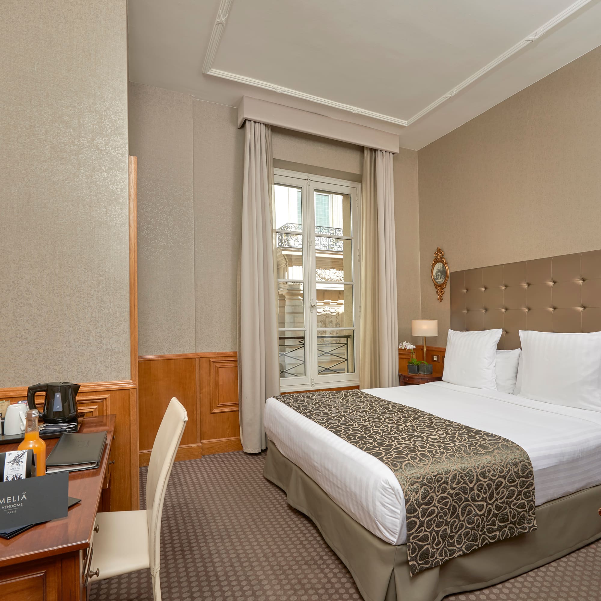 a room with a bed and a desk